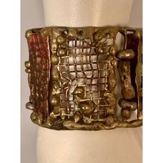 This is part of Chairish's Costume Jewelry Collection.  A striking cuff bracelet composed of hand made panels of brass and bronze by Pal Kepenyes in several different brutalist designs is from the same estate as the Milagros necklace.  This piece is unsigned and at some point the previous owner replaced the clasp.  It is in good, unsigned condition. Measurements; Length 7"    Width 1.75" Brutalist Jewelry, Brutalist Design, Victorian Jewelry, Manners, Costume Jewelry, Cuff Bracelet, 1970s, Jewelry Collection, Hand Made