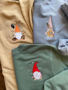 Thanksgiving Gnome Embroidered crewneck sweater **Free Shipping** A comfy cozy pullover crewneck in multiple seasonal colors. 9 oz 80/20 cotton/polyester blend Split stitch double needle sewing on all seams Twill neck tape 1 x 1 ribbing at neck, cuffs and waistband Crewnecks are pigment dyed The pigment-dyeing process gives each garment unique character. Please allow for slight color variation in production and washing. Fall Crew Neck Sweater With Custom Embroidery, Fall Embroidered Sweater, Thanksgiving Gnome, Split Stitch, Fall Crewneck, Halloween Hoodie, Embroidered Crewneck, Cozy Pullover, Embroidered Sweater