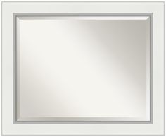 a white frame with a square mirror on the wall in front of it and an empty space for text