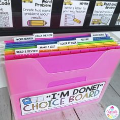 a pink file box filled with lots of writing materials