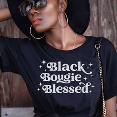 "Introducing our \"Black Bougie Blessed\" t-shirt, a stylish and comfortable addition to your wardrobe that celebrates the pride and joy of Black culture. Crafted from high-quality materials, this shirt features a bold and empowering message that speaks to the unique experience of being Black and feeling blessed. The phrase \"Black Bougie Blessed\" is a nod to the rich history and traditions of Black excellence, while also highlighting the resilience and strength of the Black community. Order yours today and experience the comfort and style of a product that celebrates the unique beauty and strength of Black culture. ♥ This classic unisex jersey short sleeve tee fits like a well-loved favorite. Soft cotton and quality print make users fall in love with it over and over again. These t-shirt Trendy Black Shirt With Text Print, Trendy Black Shirt With Letter Print, Trendy Pre-shrunk Black Shirt, Trendy Black Pre-shrunk Shirt, Melanin Shirt, Blessed Shirt, Bad And Boujee, Melanin Poppin, The Pride