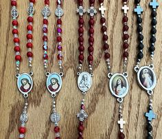 These striking, custom made in the USA, Five Wounds of Jesus Chaplets were made using Red Mashan Jade, Czech Fire Polished Crystal, Red agate, and Brecciated Jasper 6mm beads. This affordable handmade rosary is the perfect Catholic gift for Lent, RCIA, birthdays, confirmation, or Christmas. It comes with a durable, light blue, jute rosary bag and a paper indicating how to pray this beautiful chaplet. Note: Lot colors may vary slightly. Free USA Shipping Most Precious Blood Of Jesus Chaplet, Purple And White Crystal Mini Crucifix Rosaries, Adjustable Red Rosary With Round Beads, Adjustable Red Rosary With 8mm Beads, Adjustable Red Beaded Rosary, Adjustable Red Rosary, Red Adjustable Rosary With Round Beads, White Cross-shaped Rosary For Baptism, Handmade Rosary