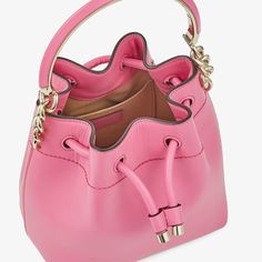 Crafted from candy pink soft shiny calf leather, the small BON BON Bucket has a sculptural shape defined by a drawstring fastening and light gold hardware. Carry in hand using the leather and metal bracelet top handle consistent with the BON BON family, or use the adjustable and detachable leather strap to wear on the shoulder or cross-body. Pink Jimmy Choo, Jimmy Choo Handbags, Jimmy Choo Bag, Metal Bracelet, Bon Bon, Candy Pink, Purse Styles, Leather Bucket Bag, Pink Candy