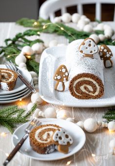 there is a roll on the table with gingerbreads and christmas decorations around it