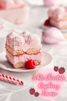 a piece of cake on a plate with raspberry frosting and strawberries