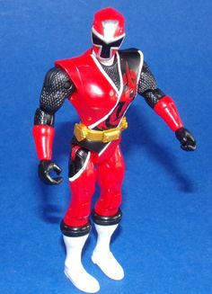 a red and black action figure on a blue background