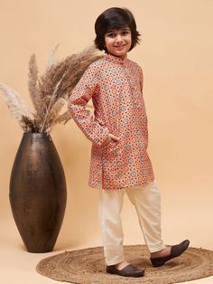 VASTRAMAY Boy's Orange Printed Kurta And Cream Pyjama Set Get your little one ready in style with the VASTRAMAY Boy's Orange Printed Kurta And Cream Pyjama Set. This vibrant outfit combines traditional elegance with comfort, perfect for festive occasions or casual wear. Features Orange printed kurta with intricate designs Cream pyjamas for a comfortable fit High-quality fabric for durability Elastic waistband on pyjamas for easy wear Specifications Color: Orange and Cream Material: Cotton Sizes Vibrant Outfits, Kurta Pyjama, Festive Wedding, Diwali Sale, Moroccan Pattern, Colour Orange, Boys Wear, Wooden Buttons, Fabric Silk