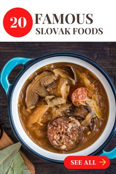 a bowl of soup with meat and vegetables in it on top of a wooden table