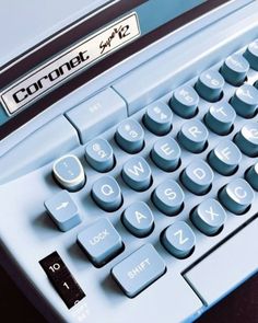 an old computer typewriter sitting on top of a table with the word control written on it