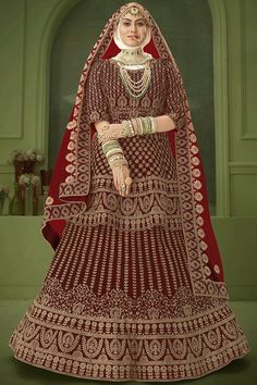 Everyone will admire you when you wear this clad to elegant affairs. Women splendor is magnified tenfold in this sort of a alluring maroon velvet lehenga choli. The embroidered, patch border and resham work appears to be chic and perfect for any event. Comes with matching choli and dupatta. Maroon Velvet Lehenga, Velvet Bridal Lehenga, Wedding Bridal Saree, Long Choli Lehenga, Dress Lehenga, Velvet Lehenga, Simple Lehenga