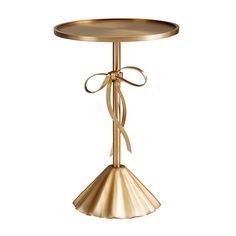 a gold table with a bow on it