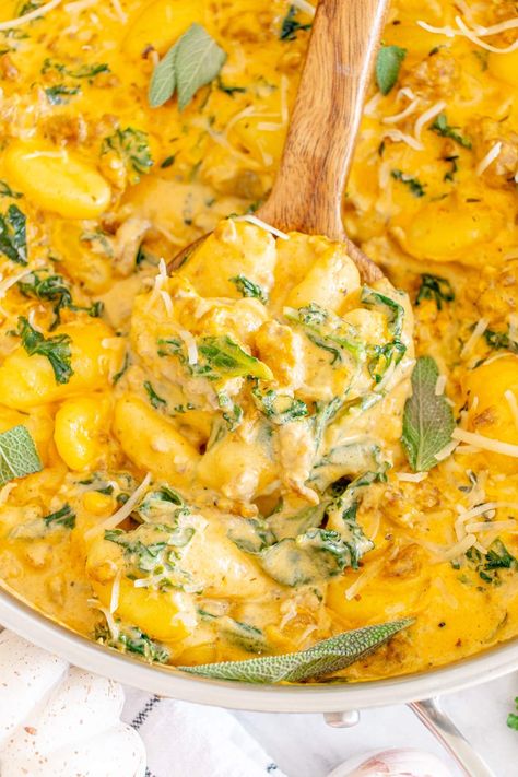 This gorgeous recipe with gnocchi, pumpkin, sausage, and kale, makes a great midweek dinner. It's so easy to make and it's also a one-pot dish so cleanup is going to be a breeze too. This dish is rich, creamy and cheesy. It's a versatile recipe that makes fantastic comfort food and it's also amazing enough for a special occasion dinner. Once you taste this incredible dish, you're going to want to make it again and again. It's everything you want - easy, tasty and appealing to the whole family! Gnocchi Pumpkin, Sausage Gnocchi, Pumpkin Sausage, Sausage And Kale, Pumpkin Gnocchi, Special Occasion Dinner, Pumpkin Delight, Creamy Macaroni And Cheese, Pumpkin Sauce