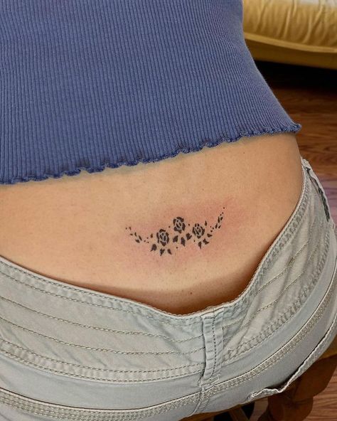 Meghan | ༺♥༻ Floral tramp stamp for Liane, thank you so much for this one! I love this placement . . . . . . . . . . . . . #handpoke... | Instagram 90s Lower Back Tattoo, Smaller Thigh Tattoos, Heart Lower Back Tattoo, Pretty Lower Back Tattoos, Tramp Stamps Classy, Dainty Line Tattoos, Sternum Floral Tattoo, Simple Lower Back Tattoos, Back Tattoo Dainty