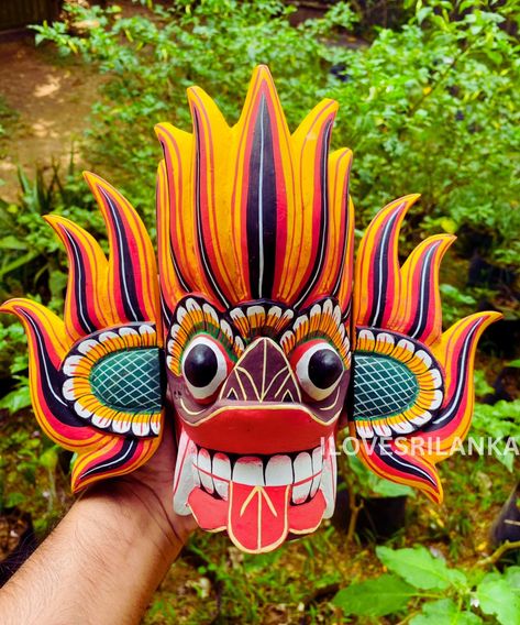 Fire Demon Mask 👹 This mask is representing the emotion anger which is why the colors are red, orange, and yellow. The patterns on the ears are warding off all evil. The patterns on the ears and the face really draw your attention which the Sri Lankan people found really important. Sri Lankan Mask, Demon Mask, Fire Demon, Devil Mask, Earring Inspo, Polymer Clay Flower Jewelry, Clay Flower, Clay Earring, Polymer Clay Flowers