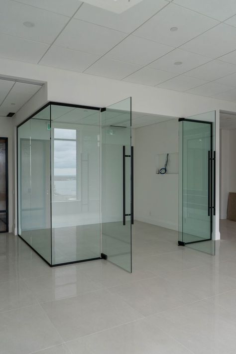 Transparent glass partitions with swing doors Office Partition Glass Design, Office Interior Design Glass Wall, Glass Partition With Door, Glass Wall Partition Design, Glass Door For Office, Office Glass Wall Design, Office Glass Door Design, Glass Wall Partition, Room Wall Aesthetic