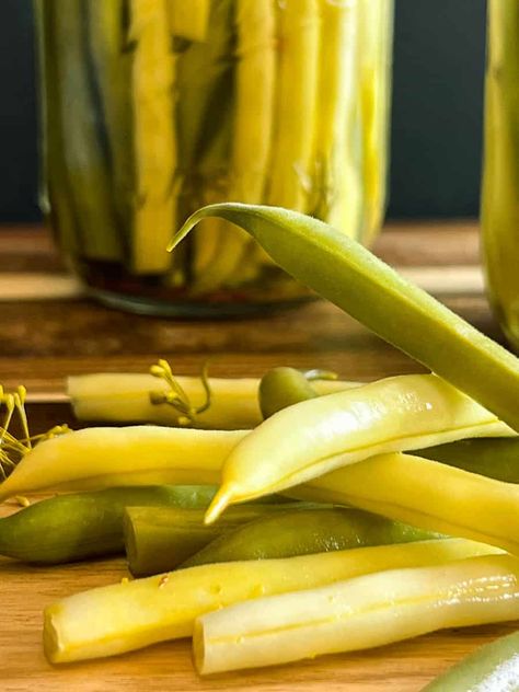 Pickled green beans use fresh green and yellow beans from the garden or farmer's market. The beans are then soaked in a hot brine made of vinegar, water, salt, and sugar. The brine is then poured into jars filled with spices and beans. It's a quick and easy dilly bean recipe! Pickled Yellow Beans, Yellow Beans Recipe, Dilly Beans Recipe, Yellow Beans, Sea Salt Recipes, Pickled Green Beans, Low Fodmap Snacks, Dilly Beans, Fodmap Snacks