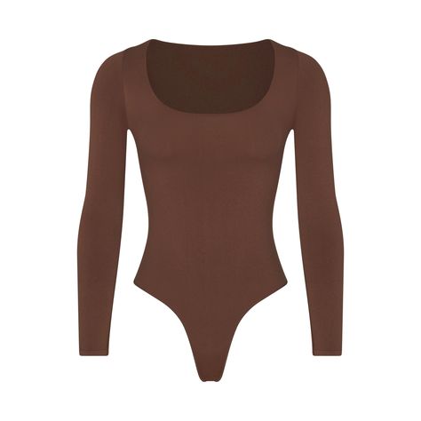 This long sleeve scoop neck bodysuit is smoothing, supportive, and fits like a second skin. Features a raw cut scoop neckline, double snap closure at the bottom gusset, and a thong back for no panty lines. Fits true to size. Investment Banker, Fall Bodysuit, Spandex Bodysuit, Brown Bodysuit, Body Manga Longa, Bodysuit Tops, Scoop Neck Bodysuit, Grey Bodysuit, Body Suit Outfits