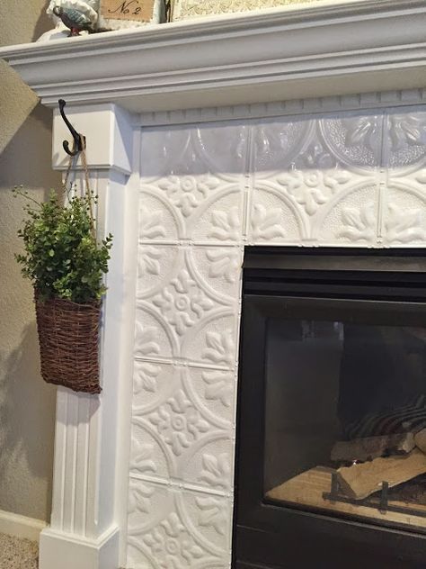 Gray And White Fireplace Tile, Fireplace Tile Cover Up, Old Fireplace Makeover Tile, Refinish Tile Fireplace, Tile Chimney Makeover, White Fireplace With Tile, Ceramic Fireplace Makeover, Fireplace Lights Ideas, Tiles On Fireplace Ideas