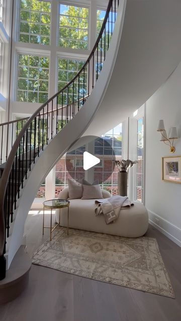 GerrardBuilders on Instagram: "Let’s hear it for the stairs!  👏👏  This architectural design is a true work of art. We love how the stairs gracefully curve up to the second-floor landing. While standing tall behind it, a wall of windows shines warm natural light into the room. And, of course, who could resist the charm of a cozy nook tucked away underneath? No detail was overlooked when creating this home!  Architectural Design @garrettpnelsonstudio Interior Design: @sbinteriors_ Photographer: @mb_productions_nc  Real estate info: @brandonlawnrealestate  Windows: Pella | @pellawindows Countertops: @artofstonecharlotte Tile: GS Construction Cabinets: Hardwood Creations: @hardwoodcreationsnc Landscape Architect: @bruceclodfelter of Bruce Clodfelter Landscaping Exterior Landscaping: Arborsca Window Under Staircase, Staircase Window, Staircase Architecture, Curved Stairs, Exterior Landscaping, Wall Of Windows, Second Floor Landing, Stair Decor, Curved Staircase