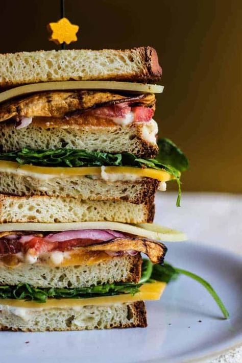 Dressed Arugula, Meatless Lunch, Club Sandwich Recipe, Eggplant Bacon, Veggie Sandwiches, Grilled Cheese Waffles, Honey Buzzard, Sandwich Vegetarian, Club Sandwiches