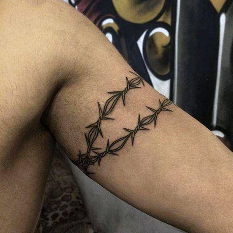 Prison tattoos and what they mean Barbed Wire Tattoo, Arm Wrap Tattoo, Wire Tattoo, Barbed Wire Tattoos, Around Arm Tattoo, Wrap Around Tattoo, Tato Dengan Makna, Wrap Tattoo, Prison Tattoos