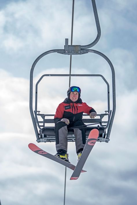 Ski Chair Lift, Graphic Narrative, Tan Leather Chair, Ski Chair, Stair Lifts, Stairs In Living Room, Trendy Rug, Ski Equipment, Person Sitting