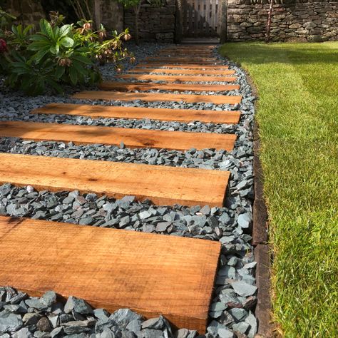 Oak timber sleepers, laid on 'flat' to create a garden path. Supplied by Bendrey Bro's in Bristol

#oak #sleepers #gardenpath #steppingstones #greenbearlandscaping Timber Sleeper Path, Timber Footpath Garden Paths, Garden Stone Ideas, Decking Path, Sleepers Garden Ideas, Sleeper Path, Pebble Path, Outdoor Beach Decor, Garden Path Ideas