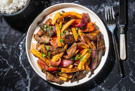 Lomo Saltado (Sauteed Beef Tenderloin) - The Washington Post Lomo Saltado Recipe, Saltado Peruvian, Whole Beef Tenderloin, Peruvian Dishes, Lomo Saltado, Peruvian Cuisine, Peruvian Food, Fried Beef, Cooking White Rice