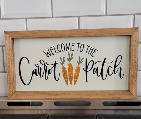 "Welcome to the carrot patch is a perfect addition to your Easter/ Spring decor measures: 7 3/8\"H x 14\"W **berry garland and carrots not included** All of my signs come ready to hang with a sawtooth hanger attached. Most of them are designed to also stand upright on their own giving you the option to place on mantels, shelves, furniture etc.    **All signs are listed with approximate measurements. Please reach out to me if you are looking for a custom size.    EACH SIGN IS HAND-MADE BY ME. I select each piece of wood which then I cut, sand, paint, seal, stain(frames) and assemble.      MATERIALS: Wood, paint, stain, sawtooth hanger    **Please note**  >>No two signs will look exactly the same. Each piece of wood has its own natural perfect imperfections such as knots, holes, small cracks Easter Signs Wooden, Marker Projects, Spring Signs, Shelves Furniture, Easter Spring Decor, Easter Wood Signs, Spring Wood Crafts, Carrot Patch, Cricket Projects