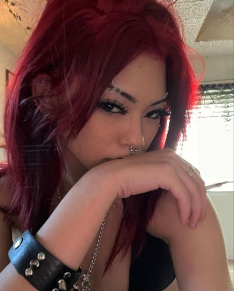 Red Hair Metalhead, Bright Red Hair On Tan Skin, Red Hair Baddie Outfits, Dark Red Hair Makeup, Red Hair Grunge Aesthetic, Red Goth Hair, Red And Black Hair Aesthetic, Red Hair Girl Pfp, Red Hair And Piercings