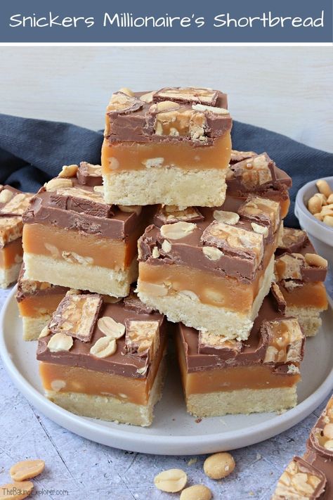 Snickers Millionaire's Shortbread, caramel slice with peanuts, buttery shortbread, milk chocolate and Snickers bar pieces. Delicious traybake recipe, indulgent and great for bake sales!