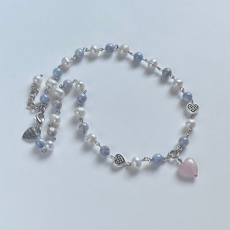 "Handmade Dreamy Pearl Necklace ♡ I also have a matching bracelet available! ✿ Made with shell beads, freshwater pearls, a rose quartz heart, and metal accents ✿ Silver, pearlescent white, lavender with a blue tint, and petal pink (the rose quartz heart varies in color) ✿ 16\" and an additional 1.75\" of extension chain" Rose Quartz Necklace Beads, Lover Necklace, Pink Quartz Necklace, Blue Bead Necklace, Beaded Necklaces, Handmade Necklace, Pearl Necklace Designs, Blue Beaded Necklace, Beaded Necklace Designs