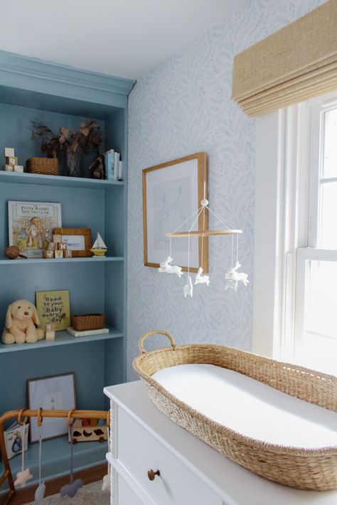 Blue And Rattan Nursery, Coastal Nursery Wallpaper, Classic Blue And White Nursery, California Coastal Nursery, Blue And White Nursery Girl, Feminine Blue Nursery, Cornflower Blue Nursery, Light Blue Girls Nursery, Light Blue Baby Girl Nursery