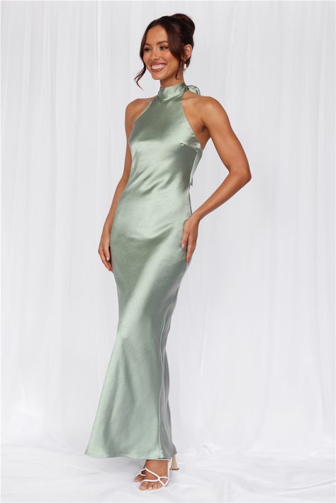 Length from neck to hem of size S: 142cm. 
 Chest: 36cm, Waist: 34cm, across front only of size S. 
 Maxi dress. 
 Lined. 
 Model is a standard XS and is wearing size XS. 
 True to size. 
 Non-stretch. 
 Luxurious satin. 
 Halter tie neckline. 
 High neck. 
 Elastic back. 
 Vent extension. 
 Straight, flowy silhouette. 
 Zipper with hook eye closure.  
 Cold hand wash only. 
 Polyester. 
 This material is very delicate. Please handle with care. 
 Please Note: This product is a Exclusive.  
 
 St Dress Sage, Camisole Dress, Maxi Dress Wedding, Satin Maxi, Satin Maxi Dress, Green Satin, Outfit Summer, Shop Maxi Dresses, Hook Eye