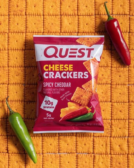 Meet the Quest™ Spicy Cheddar Cheese Crackers! 💪🔥🧀🍘 These savory, delicious, & athlete-worthy protein cheese crackers are bursting with real cheese flavor + that spicy kick you crave - 10g protein & 5g net carbs per bag. 😋🥵 AVAILABLE NOW online & in stores at QuestNutrition.com, Amazon, Vitamin Shoppe, Wegmans (Northeast, Mid-Atlantic), & your local health/nutrition stores nationwide. Protein Crackers, Cheesy Snack, Nutrition Store, Quest Nutrition, Car Console, Cheese Cultures, Cracker Snacks, Cheese Flavor, Cheese Crackers