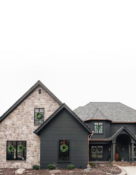 The Exterior of Our Home, Today - Chris Loves Julia Moody Brick Exterior, Dark Exterior Brick House, Black And Stone Exterior House, Black House With Stone Accents, Black Accent Exterior House, Dark Exterior With Light Stone, Graphite Siding Exterior, Black House With White Stone, Black Stone House Exterior