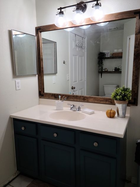 Budget Makeover, Bathroom Vanity Makeover, Blue Vanity, Mirror Makeover, Blue Cabinets, Wooden Mirror, White Countertops, Kitchen Design Decor, Office Bathroom