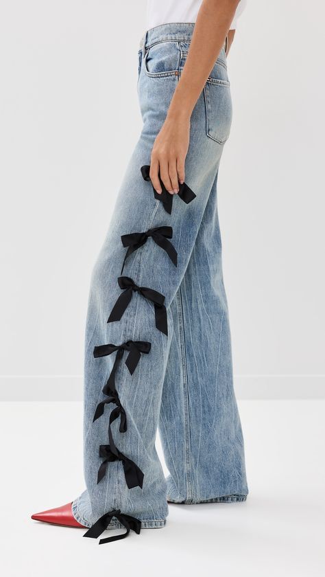 Find ALICE + OLIVIA Weezy Full Length Jeans With Side Bows on Editorialist. Fabric: Mid-weight, non-stretch denim. Satin bow embellishments. Button closure and zip fly. 5-pocket styling. Shell: 100% cotton. Dry clean. Imported, China. Measurements: Measurements from size 24 Rise: 10.75in / 27cm Inseam: 33.75in / 86cm Leg opening: 19.75in / 50cm Olivia Outfits, Bow Embellishments, Bow Jeans, Denim Editorial, Full Length Jeans, Jeans Store, Denim Diy, Satin Bow, China Fashion