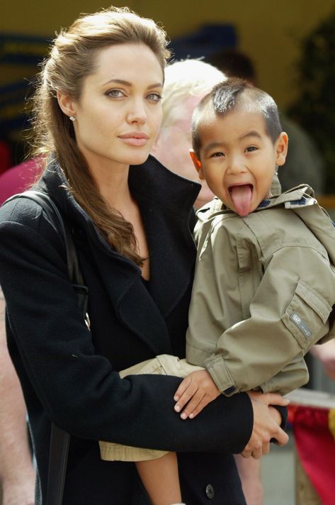 Angelina Jolie adopted her first child Maddox Chivan Jolie-Pitt from a Cambodian orphanage in 2002. Famous Celebrity Couples, Brad And Angelina, Brad Pitt And Angelina Jolie, Angelina Jolie Photos, Cute Celebrity Couples, Jolie Pitt, Pregnant Celebrities, Famous Couples, Celebrity Kids