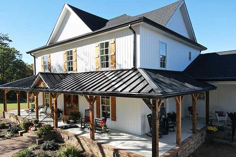 Black Metal Roof Farmhouse White Siding, Metal Roof Covered Patio, Tin Roof Front Porch Addition, Metal Roof On Porch, Metal Covered Porch, Painting A Tin Roof, White House With Copper Metal Roof, Metal Front Porch Roof, Black House Metal Roof