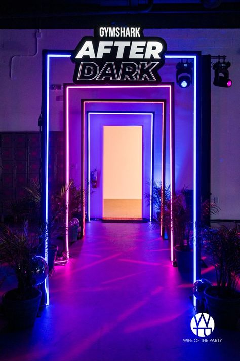 A stunning entrance way that leads to the dressing rooms where guest were able to change into their new Gymshark workout sets. #wifeoftheparty #neon #entrance #gymshark #afterdark #lights #photomoment #events #partyplanner #walkway Entrance Design Event, Neon Event Decor, Neon Entrance, Nightclub Entrance, Neon Arch, Festival Entrance, Neon Event, Event Entrance Design, Event Entrance Arch Design