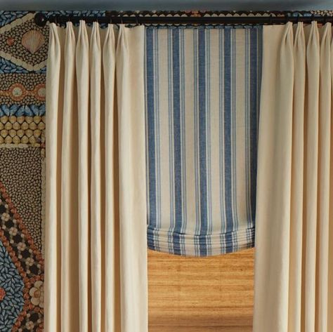 The Shade Store on Instagram: "Design tip: Two bold patterns can live side-by-side when separated by a neutral layer. For the windows of @kbshowhouse, designer @marymcdonaldinc turned to @TheShadeStore to craft three layers of custom window treatments. The base layer of a Woven Wood Shade reflects the natural elements of the room design, a Relaxed Roman Shade in a @Schumacher1889 fabric of her own design pulls in tones of blue from the dramatic Shell Grotto wallpaper for which the room is names and the simple cream Tailored Pleat drapery panels provide a visual break between the two different patterns. Achieve the look: Product: Waterfall Woven Wood Shades Fabric: Sienna Color: Almond Product: Relaxed Roman Shades Fabric: C.O.M by @Schumacher1889 Product: Tailored Pleat Drapery Fabr Shell Grotto, Sienna Color, Relaxed Roman Shade, The Shade Store, Woven Wood Shades, Shade Store, Stair Landing, 2023 Design, Tones Of Blue