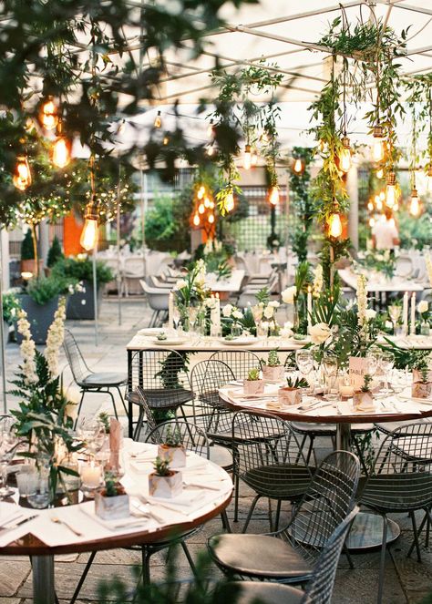 Urban chic weddings have officially been redefined thanks to this incredible destination wedding in Greece. Picture a modern museum wedding venue dripping in greenery with hanging Edison bulbs, black metal details and pops of gold. Urban Garden Wedding, Industrial Garden Wedding, Green Industrial Wedding, Urban Industrial Wedding Decor, Urban Wedding Decor, Industrial Loft Wedding Decor, Contemporary Greenhouses, Urban Chic Wedding, Edison Bulb Chandelier Wedding