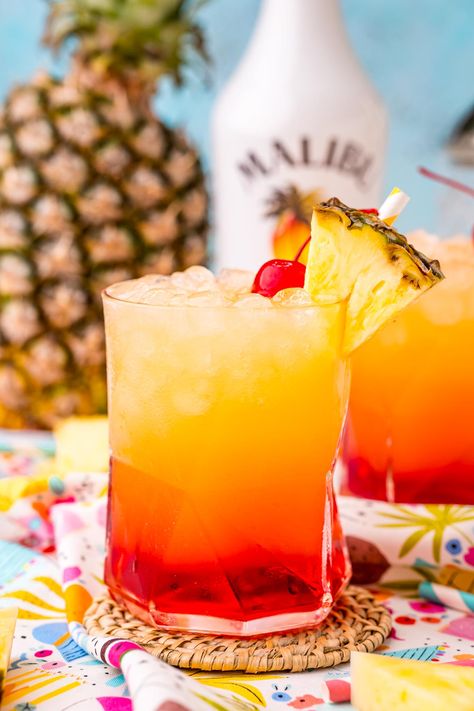 Malibu Sunset Drink is a tropical cocktail made with pineapple juice, coconut rum, and homemade grenadine syrup for the perfect summer drink! Malibu Sunset Cocktail Recipe, Sunset Drink Recipe, Sunset Cocktail Recipe, Homemade Grenadine, Beer Cocktail Recipes, Rum Drinks Recipes, Malibu Drinks, Sunset Restaurant, Sunset Drink