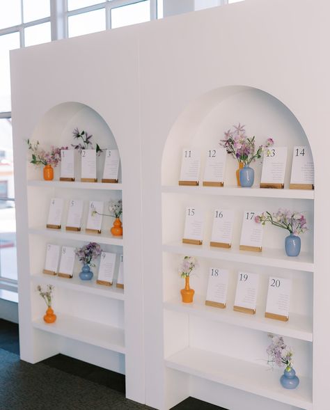 A seating chart Very Elegant, Very Thoughtful🤌🏼 featuring the popular Double Shelf Isla Arch that is versatile and chic to fit any event theme and purpose✨ Photography: @apollofotografie Planning: @nomadnixon Venue: @sfgalleriaevents Florals: @duet.botanical What would you use the Double Isla Shelf Arch for? Seating Chart Shelf Display, Seating Chart Shelf, Wedding Sitting Plan, Event Themes, Seating Chart Wedding, Seating Chart, Wedding Seating, Seating Charts, Wedding Arch