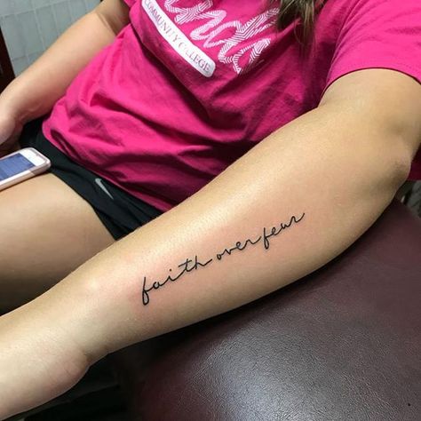 32 Best Faith Over Fear Tattoo Ideas  15 Faith Over Fear Tattoo Ideas, Fear Tattoo Ideas, Faith Over Fear Tattoo, Tattoo For Women Arm, Tattoo Above Knee, Fear Tattoo, Side Arm Tattoos, Tattoo Over Scar, Cursive Tattoos