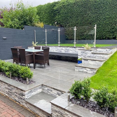 We love how this design has created 3 garden levels separating the upper lawn area with glass balustrade from a paved outdoor dining space.  #gardenideas #gardeninpiration #paving #balustrade #gardendesign #gardens #landscaping Tiered Garden Ideas, Tiered Gardens, Tiered Landscape, Front Garden Ideas Driveway, Garden Design Outdoor, Small Garden Plans, Garden Ideas Driveway, Garden Ideas Uk, Terraced Garden