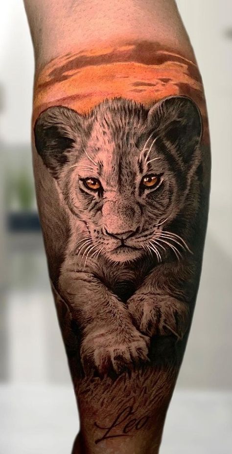 Eye-Catching Lion Tattoos Lion King Tattoo Men, Baby Cub Tattoo, Lioness Cub Tattoo, Lion Cub Tattoo Design, Baby Animal Tattoos, Baby Lion Tattoo, Little Lion Tattoo, Lion And Cub Tattoo, Leo Lion Tattoos