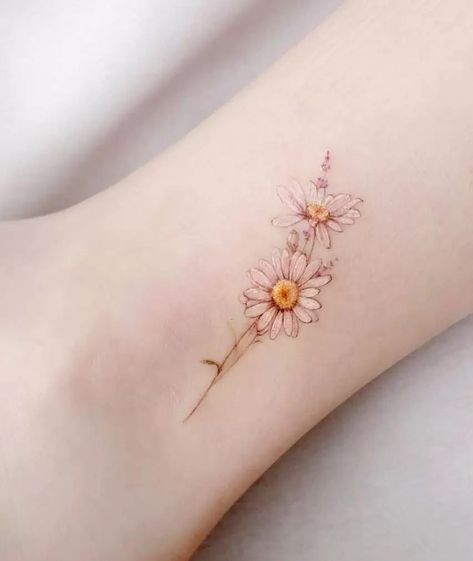 The Ultimate Guide To Flower Tattoos Dainty Daisy Flower Tattoos, Delicate Daisy Tattoo Simple, Small Watercolor Flower Tattoo, Small Daisy Flower Tattoos, Daisy Tattoo Designs Vintage, Small Dainty Flower Tattoos, Soft Flower Tattoo, Delicate Daisy Tattoo, Daisy Tattoos For Women