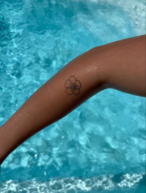 Flower Beach Tattoo, Beach Flower Tattoo Ideas, Hibiscus Tattoo Wrist, Hibiscus Tattoo Minimalist, Minimalist Hibiscus Tattoo, Aloha Flower Tattoo, Hibiscus Tattoo On Arm, Small Tropical Flower Tattoo, Beachy Flower Tattoos